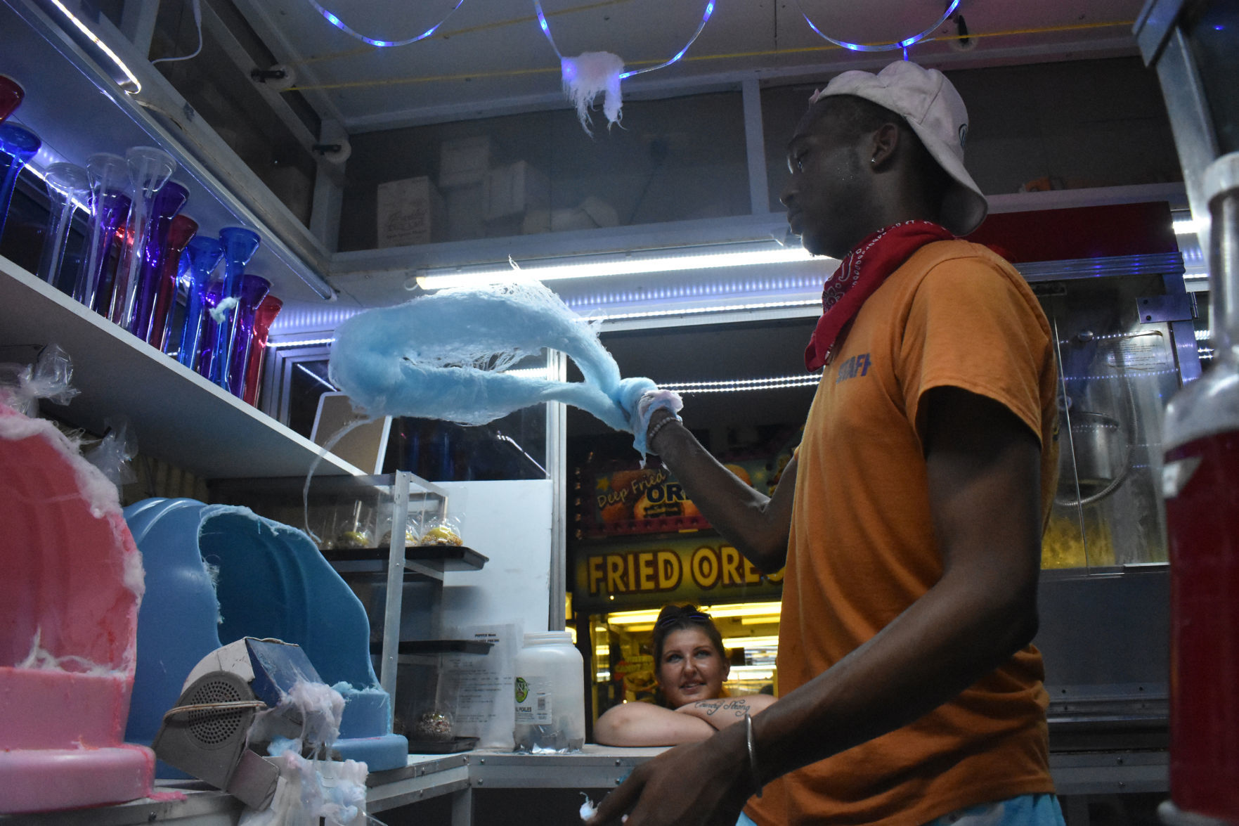 Making cotton candy at the fair